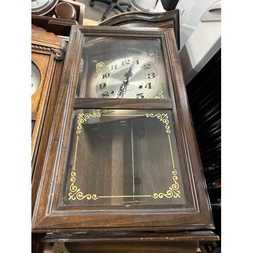 2322 - A collection of five clocks; 4 long cased wall clocks and 1 mantel clock (used)