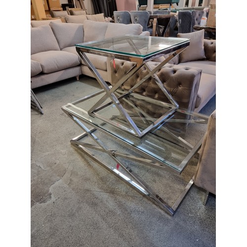 1525A - A chrome and glass coffee table and lamp table *This lot is subject to VAT