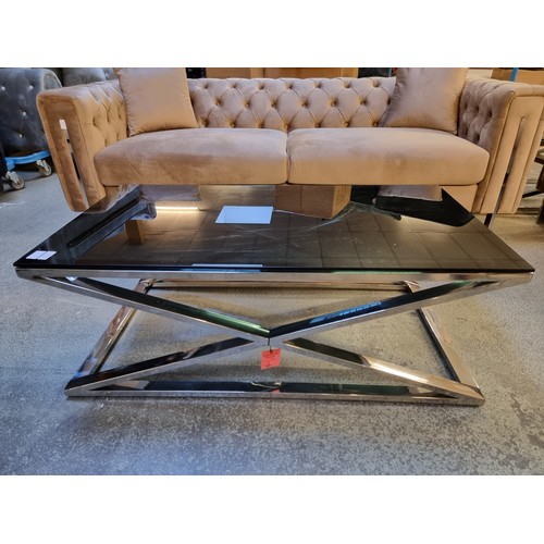 1538A - A Black glass and chrome 'x' base coffee table *This lot is subject to VAT