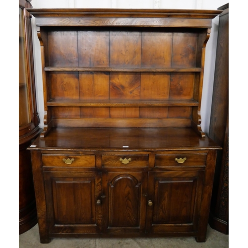 A George III style oak and elm dresser