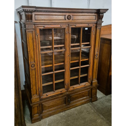 132 - A Victorian Aesthetic Movement oak two door bookcase