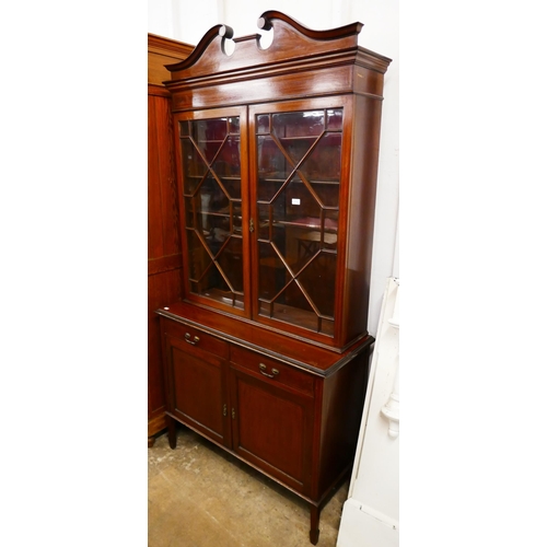 103 - An Edward VII inlaid mahogany bookcase