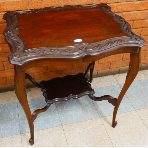 112 - An Edward VII carved mahogany occasional table