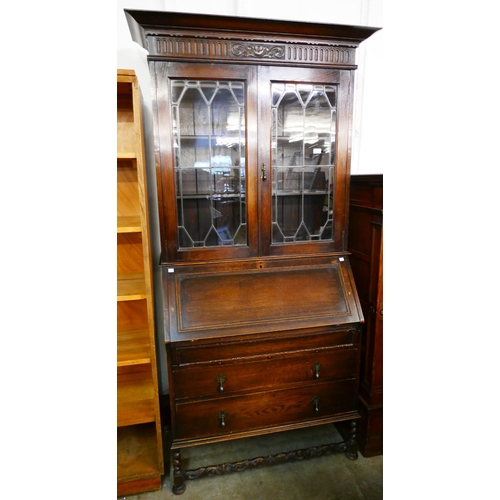 133 - An early 20th Century oak bureau bookcase