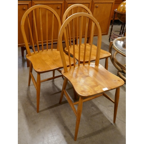 14 - A set of three Ercol Blonde elm and beech Windsor chairs