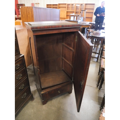 154 - A Victorian mahogany single door cupboard