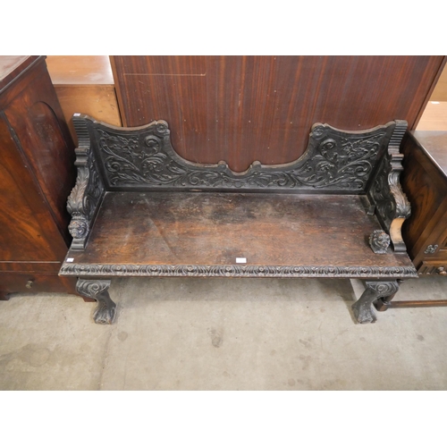 155 - A Victorian Jacobean Revival carved oak window seat