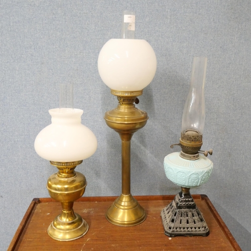 349 - A Victorian oil lamp and two early 20th Century brass oil lamps