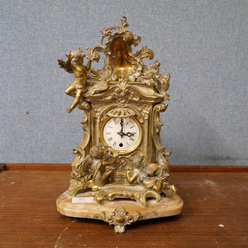 365 - A 19th Century French Rococo Revival gilt metal mantel clock