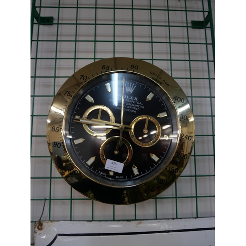 375 - A Rolex style dealers display wall clock