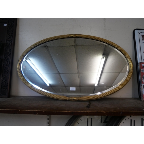 386 - A Victorian oval gilt framed mirror