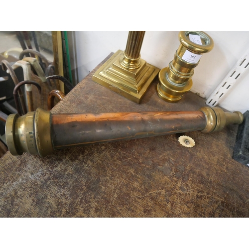 393 - A brass fire hose nozzle, one other nozzle and a brass lamp base