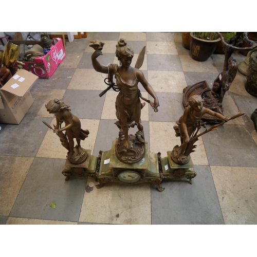 407 - A 19th Century French figural spelter and onyx clock garniture