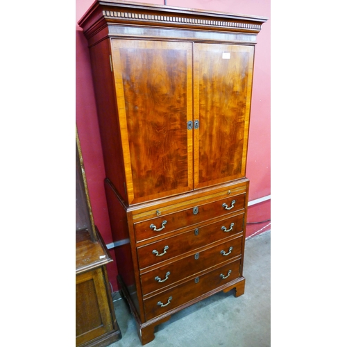 99 - A George III style mahogany cocktail cabinet