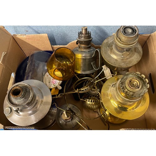 356 - Two oil lamps, oil lamp bases and parts