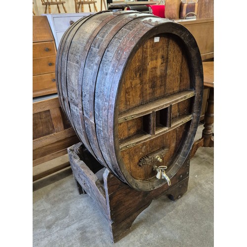 598 - A large French coopered oak wine barrel on stand