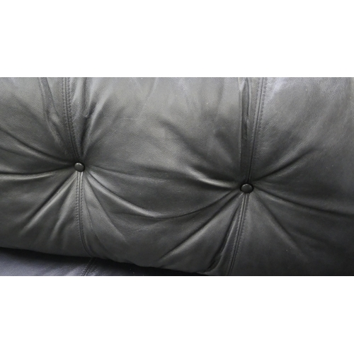 1376 - A black leather three seater sofa