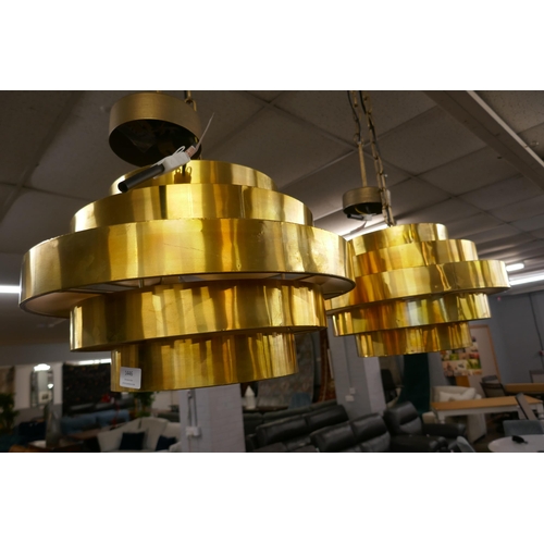 1438 - A pair of gold steel retro ceiling pendants