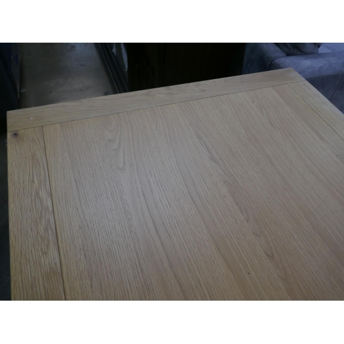 1450 - An oak dining table with white legs *This lot is subject to VAT