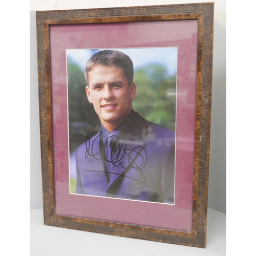 602 - A signed picture of Michael Owen, framed