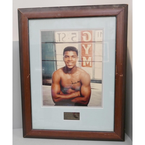 603 - A framed presentation autograph of Muhammed Ali with certificate of authenticity numbered 993149 fro... 