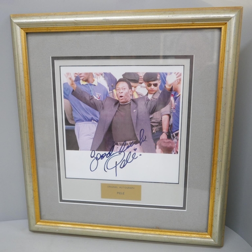 604 - A framed presentation autograph of Pele with certificate of authenticity numbered 993161 from Walt D... 