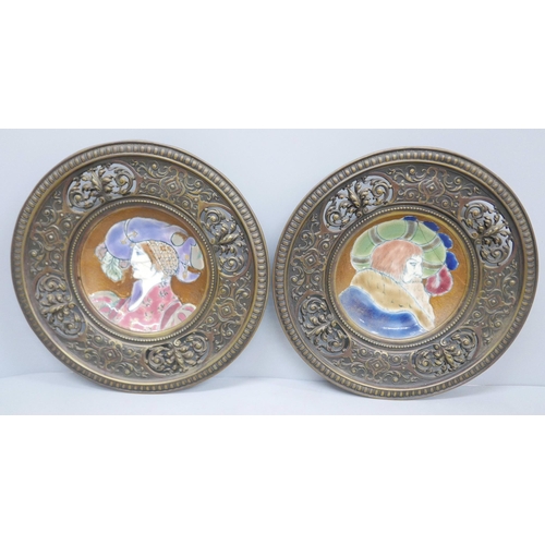 608 - A pair of Limoges plates mounted in pierced cast metal circular frames, 25cm diameter, both plates a... 