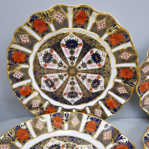 610 - A set of six Royal Crown Derby 1128 wavy edge side plates and one other 1128 circular side plate, 21... 