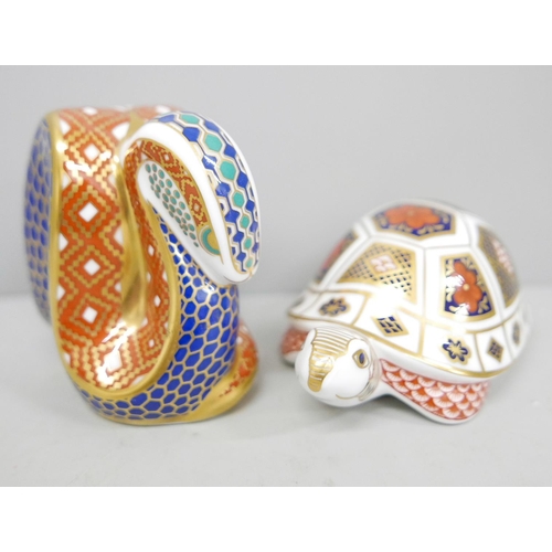 621 - Two Royal Crown Derby paperweights, snake with gold stopper and turtle with fixed stopper