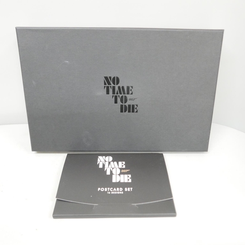 623 - A James Bond No Time to Die postcard set and a gold plated key chain and postcard set, boxed