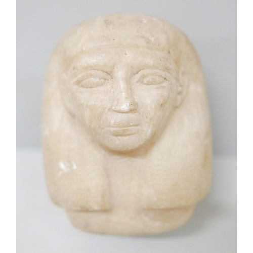 628 - A carved alabaster sculpture, head of an Egyptian Pharoah, 10cm
