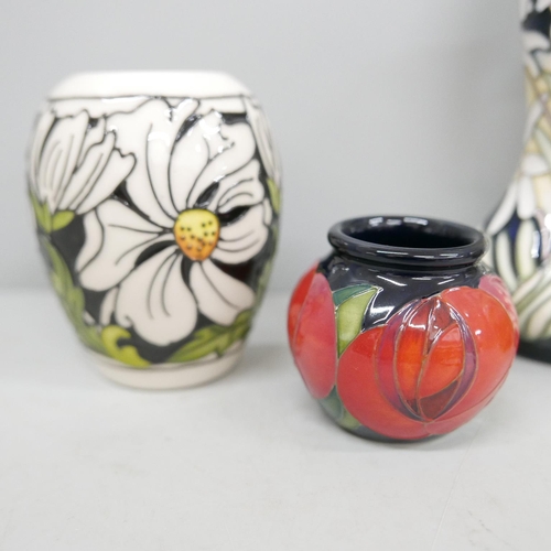 644 - A Moorcroft Rose Red vase designed by Emma Bossons, Seaside Pansy vase, Phoebe Summer vase and a lim... 
