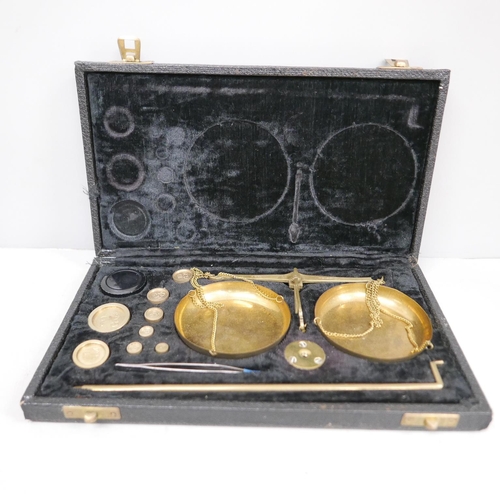 645 - A cased set of apothecary scales and weights