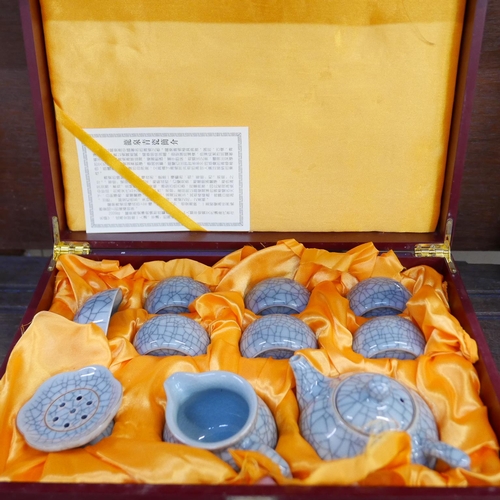 653 - A ten piece Longquan ceramic tea set in wooden presentation box