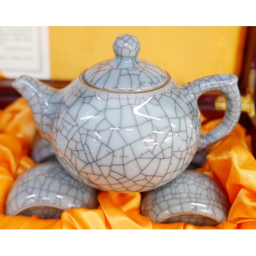653 - A ten piece Longquan ceramic tea set in wooden presentation box