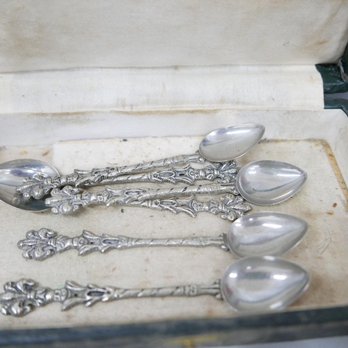 655 - A cased set of twelve continental white metal forks, marked Cristofle, six similar spoons marked Erc... 
