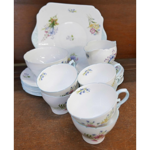 656 - Shelley Wildflowers teawares, six cups, five saucers, six tea plates, cream, sugar and a bread and b... 