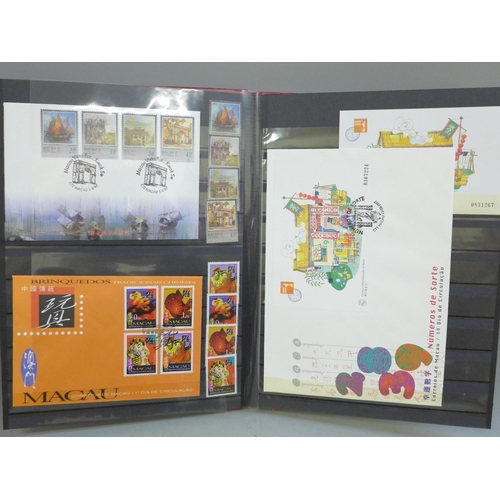 662 - Stamps; a stockbook of Macau stamps, mini sheets and first day covers from 1996 and 1997