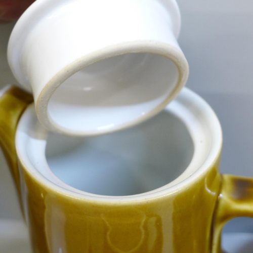697 - A Langley Pottery coffee set; six cups, six saucers, a milk jug, sugar bowl and coffee pot
