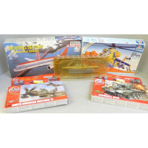 714 - Two Airfix model plane kits; one Minicraft Boeing and a Italieri Soviet helicopter kit and a model B... 