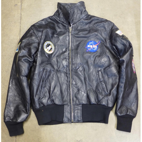 729 - A NASA leather jacket with sewn space patches, size large, purchased at Kennedy Space Centre
