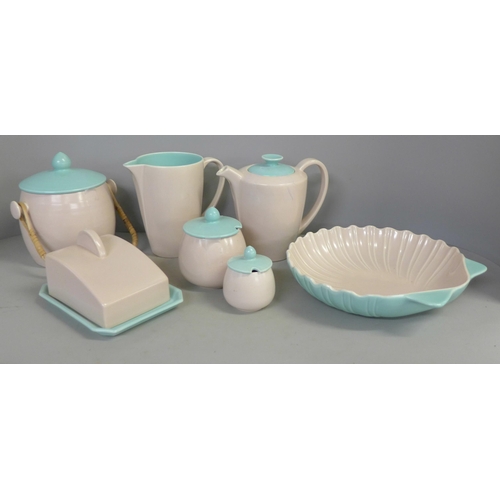 741 - A collection of Poole twintone pink and green pottery