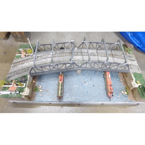 744 - A collection of model railway wagons, a canal railway diorama and collection of diorama buildings, s... 