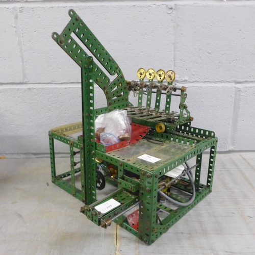 751 - A circa 1950s red/green Meccano Aunt Sally arcade game, coin operated with electric motor, 33cm wide