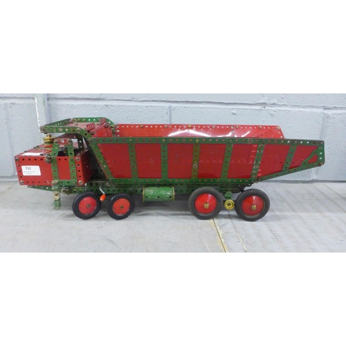 752 - A 1950s red/green Meccano dumper truck with working steering and tipping body, 65cm