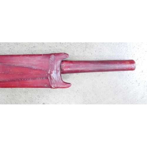 780 - An African Maasai sword in leather scabbard