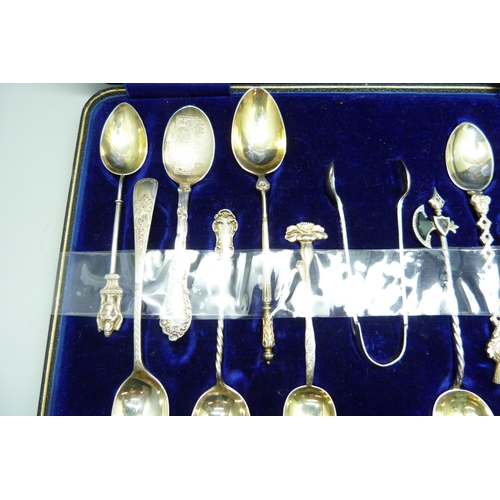 793 - Twelve assorted hallmarked silver spoons and a pair of silver sugar bows, 126g