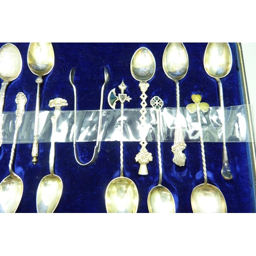 793 - Twelve assorted hallmarked silver spoons and a pair of silver sugar bows, 126g