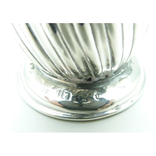 800 - A pair of fluted Victorian silver peppers, 94g