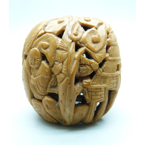 810 - A Cornish Serpentine carved model frog, a carved walnut with Buddha detail, a/f, and a Japanese scre... 